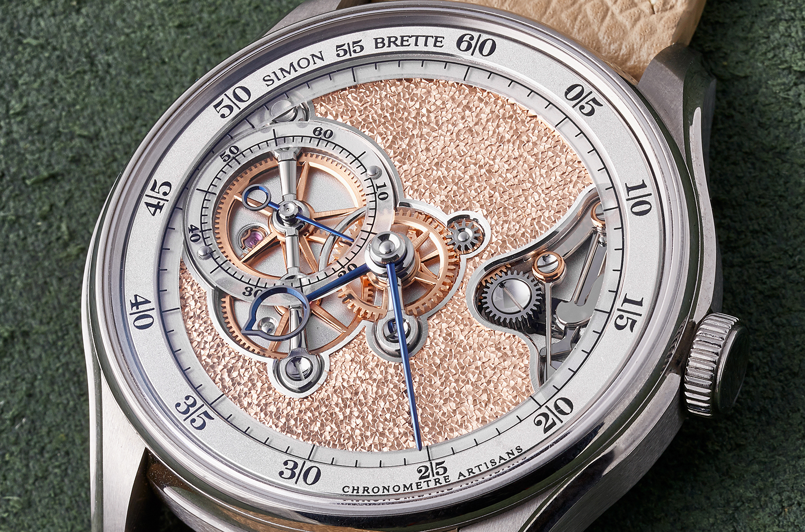 While the movement was designed with symmetry in mind, the dial has been asymmetrically open-worked, revealing the hour wheel, third and fourth wheels on the left and the keyless works in the opening on the right
