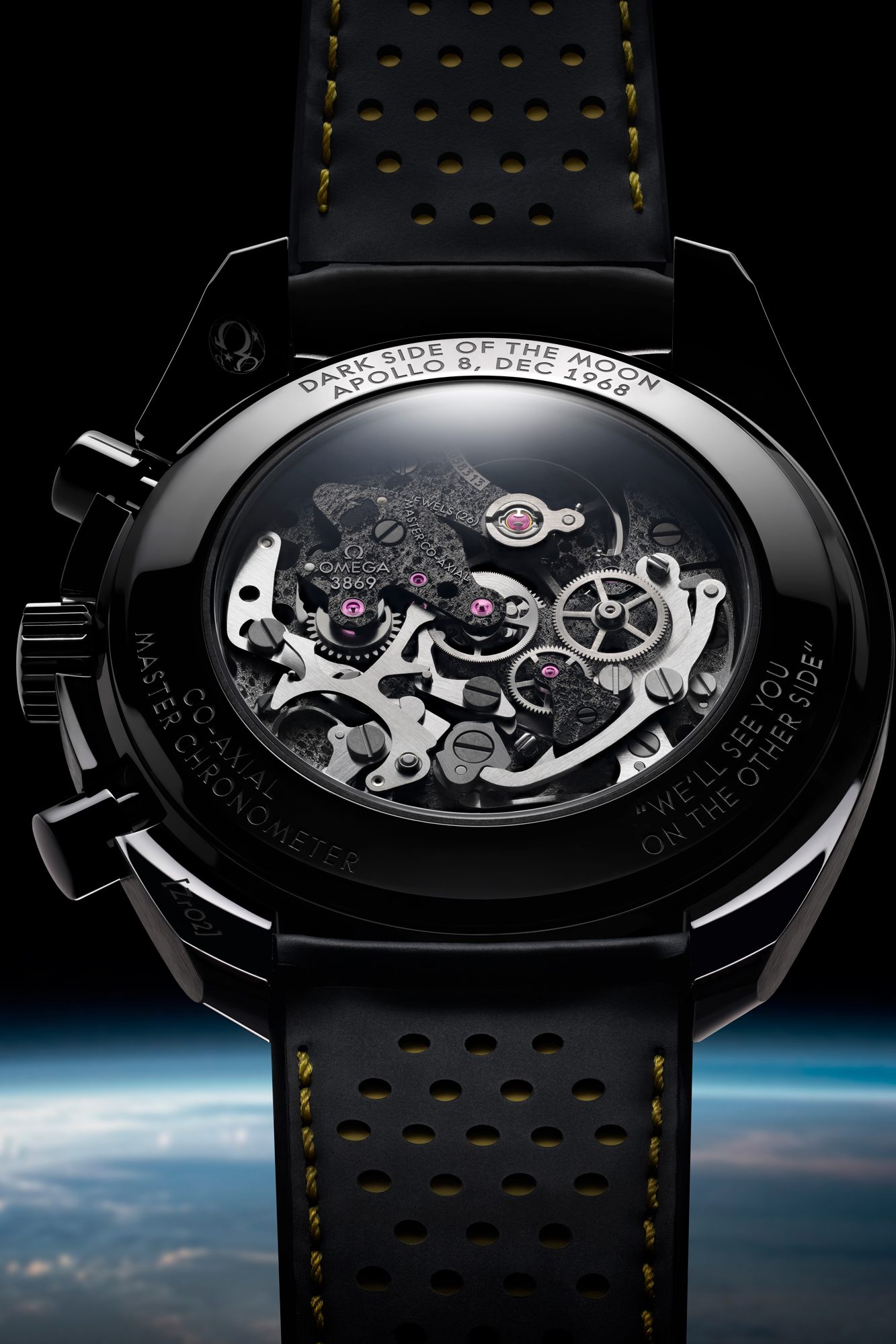 The Omega 3869 movement is co-axial and Master Chronometer certified, and it features an engraving of the surface of the dark side of the moon.