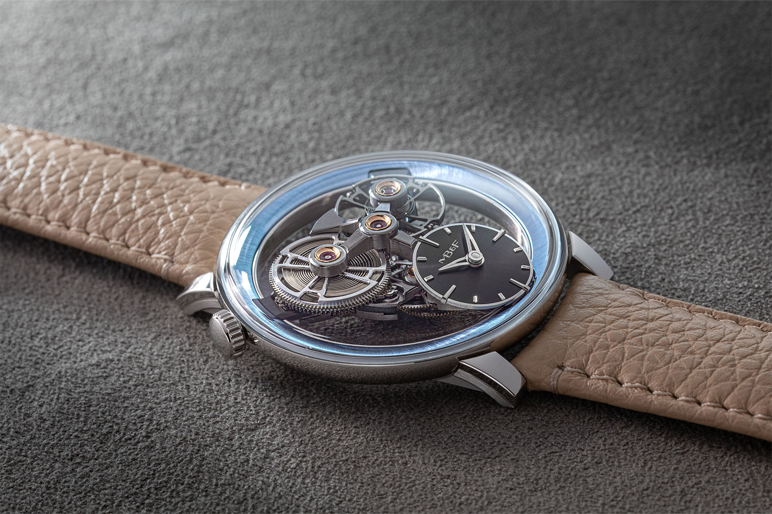 MB&F SP One platinum with sky-blue flange showing floating barrel and inclined dial