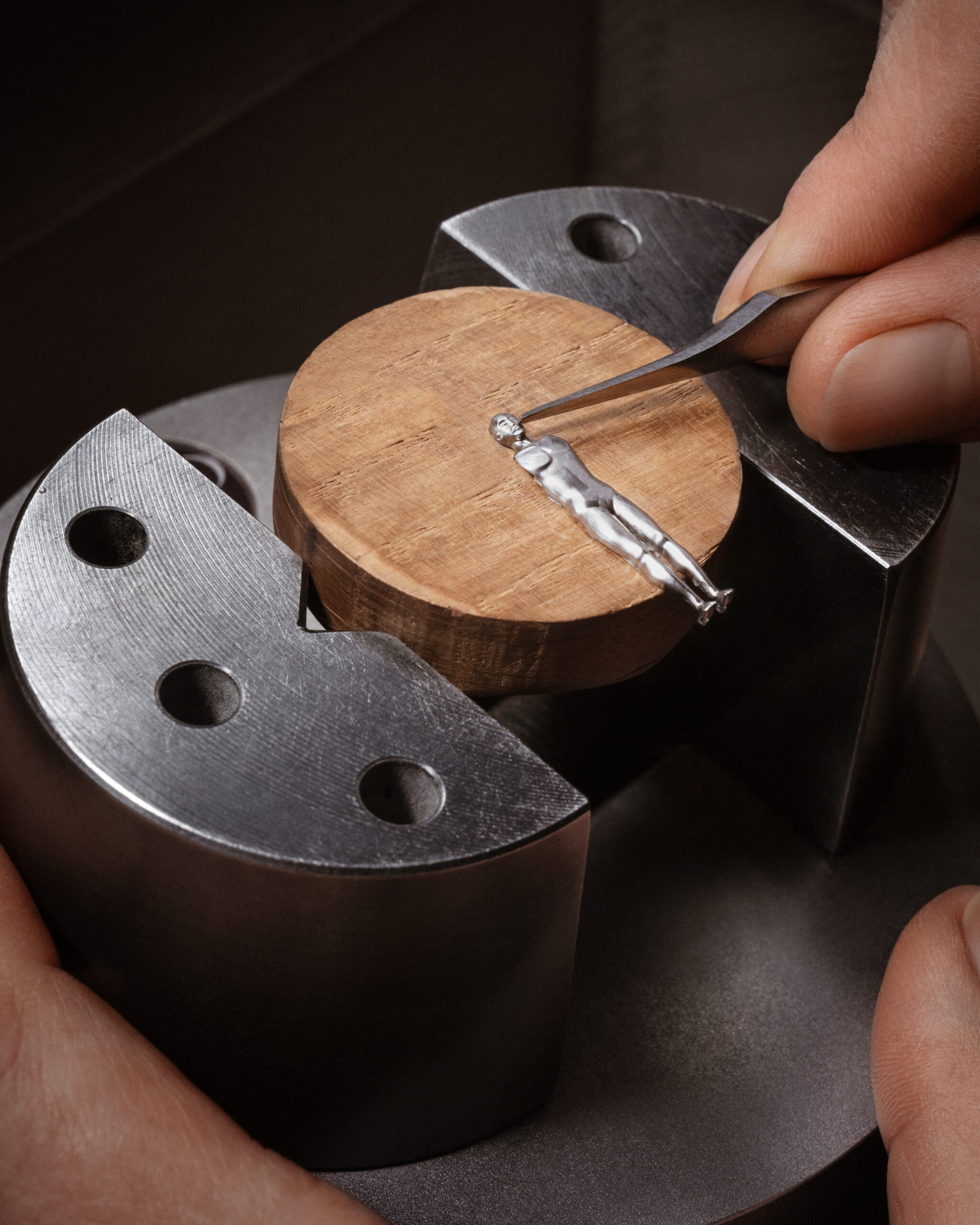 Artisan hand-engraving the figurine component for the Métiers d’Art Tribute to the Quest of Time wristwatch.