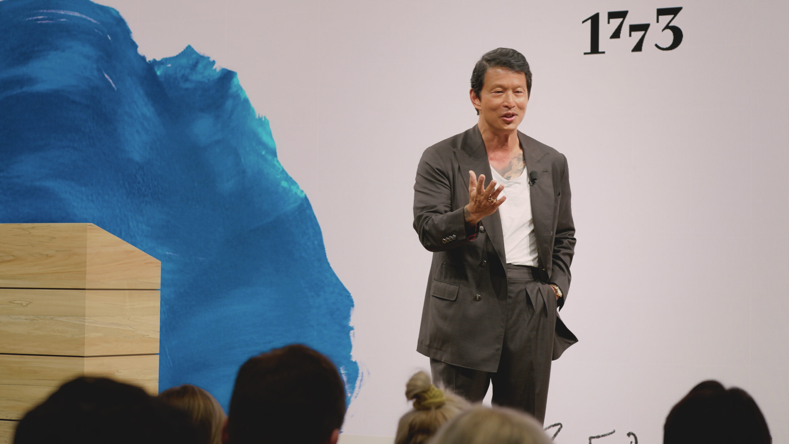 Wei Koh addressing the audience on stage during the Urban Jürgensen launch event in Los Angeles, filmed for Man of the Hour