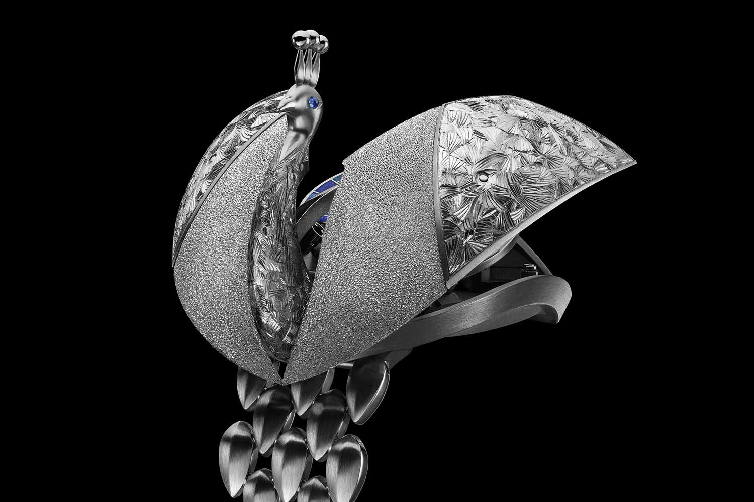 Side view of Audemars Piguet Peacock watch showing engraved feather details and partially opened wings revealing inner dial
