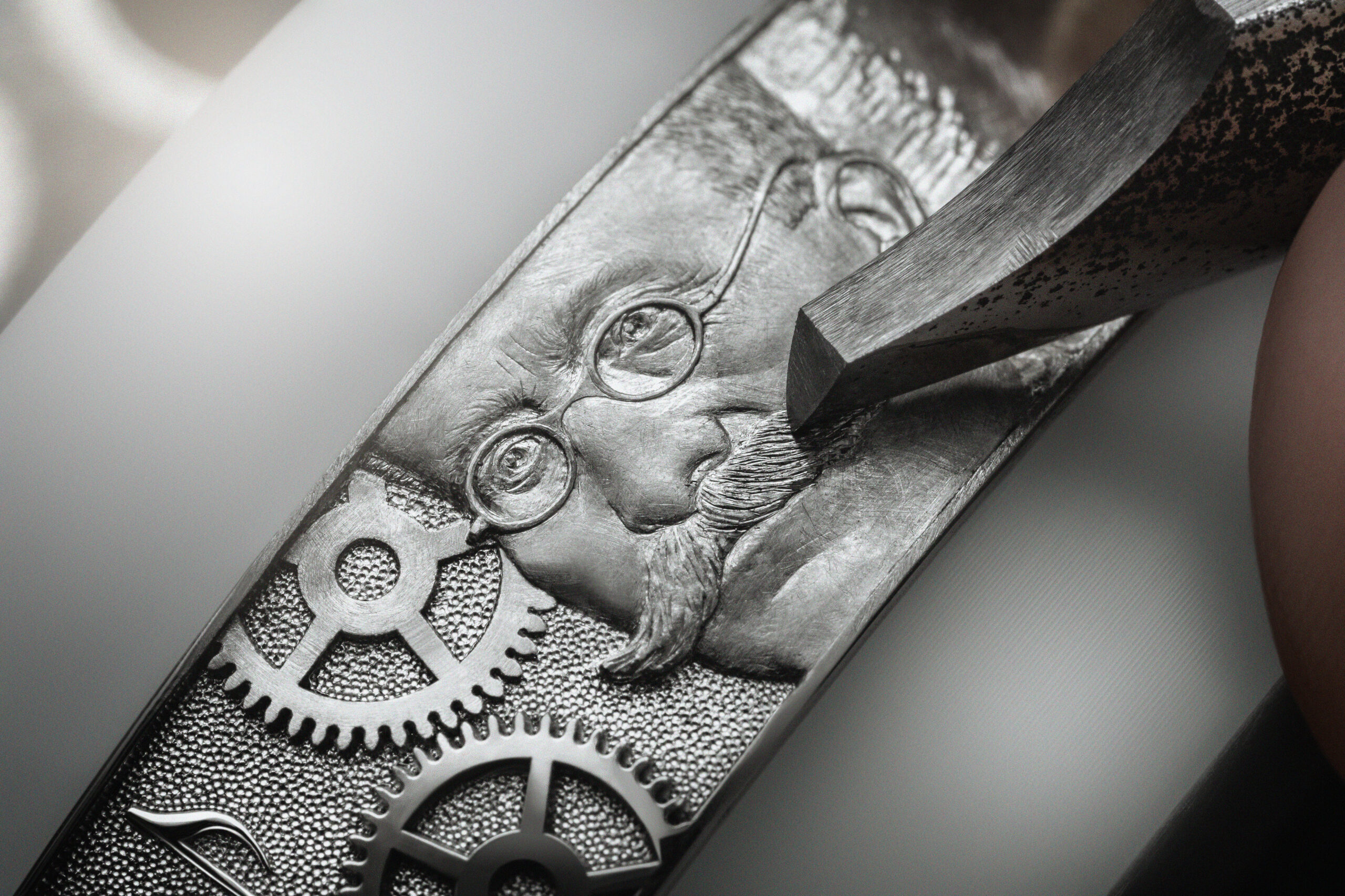 The platinum incubator case is meticulously hand-engraved with symbolic elements from the company's history, including images of its founders and the anniversary celebration logo