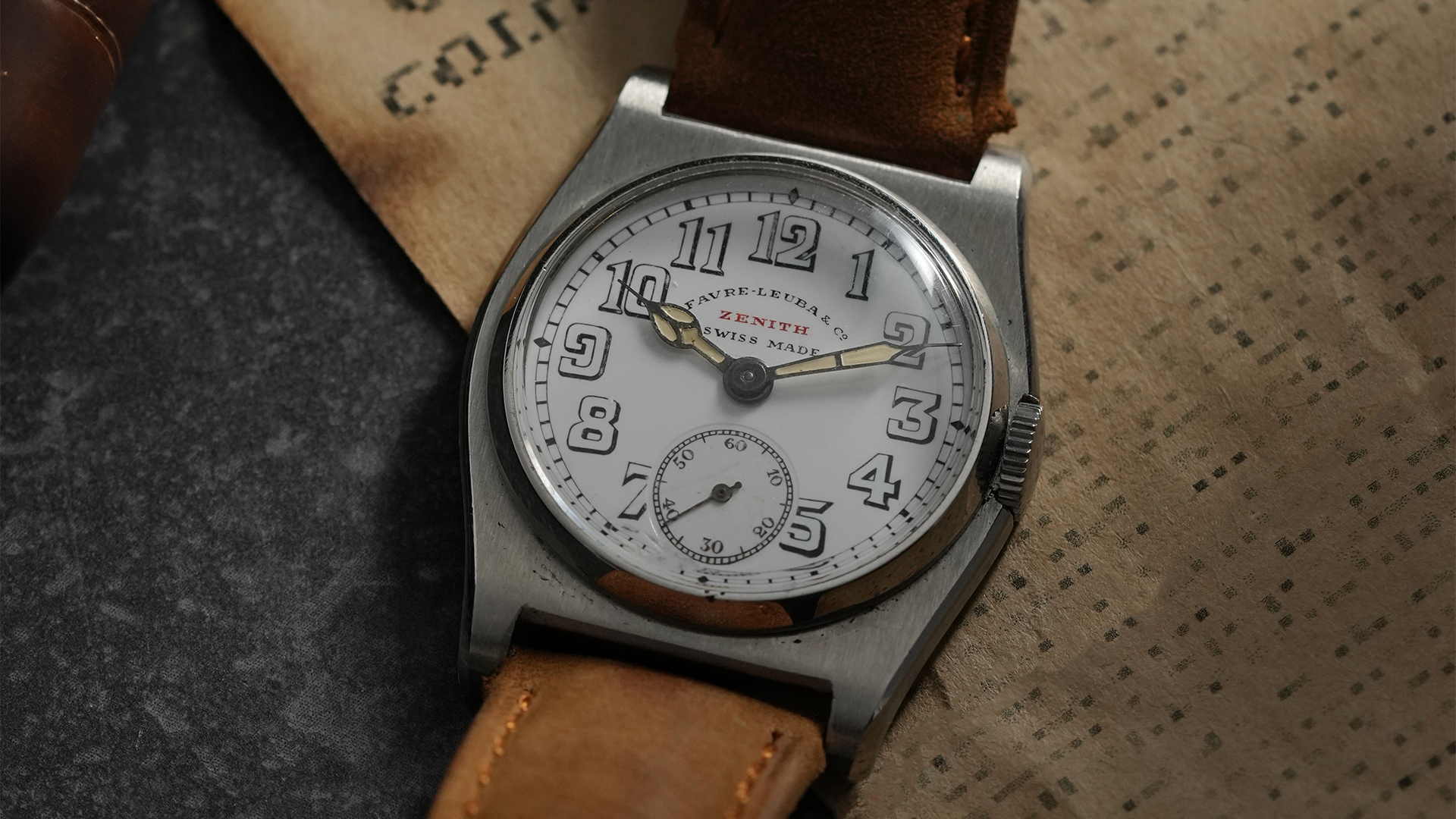 Vintage wristwatch with a co-signed Favre Leuba and Zenith dial, featuring Arabic numerals and small seconds