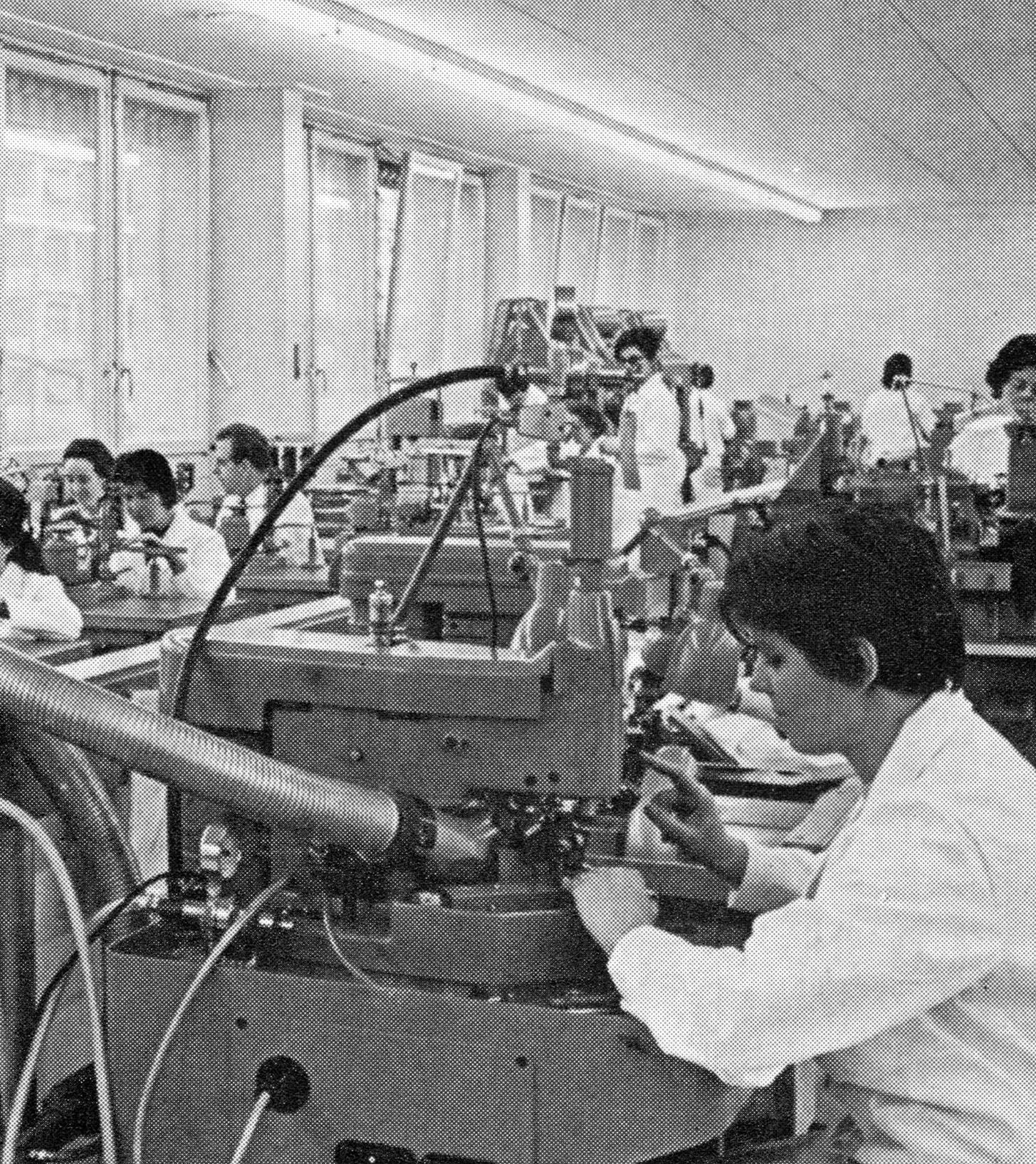 Archival photograph of Favre Leuba watchmakers working in a factory, circa late 19th century