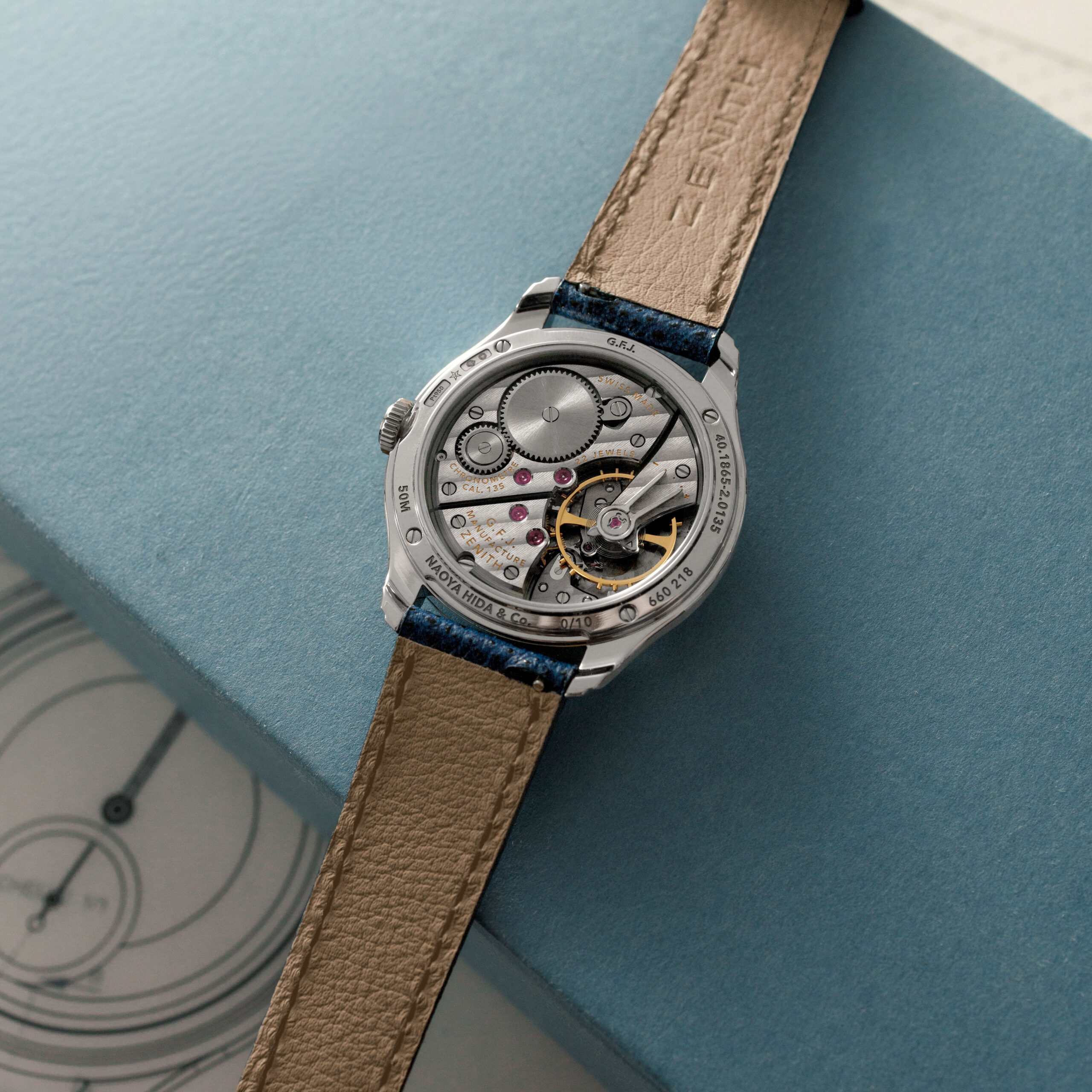 Caseback view of the Zenith G.F.J. Calibre 135 Double Signed, showing the manually wound movement with ruthenium finishing and yellow gold engravings