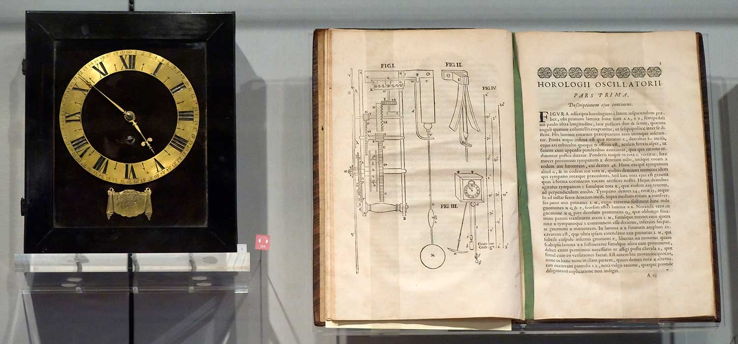 One of the first pendulum clocks designed by Christiaan Huygens, and his treatise on the pendulum, Horologium Oscillatorium published in 1673, on display in Museum Boerhaave in Leiden, Netherlands (Image: Wikipedia)